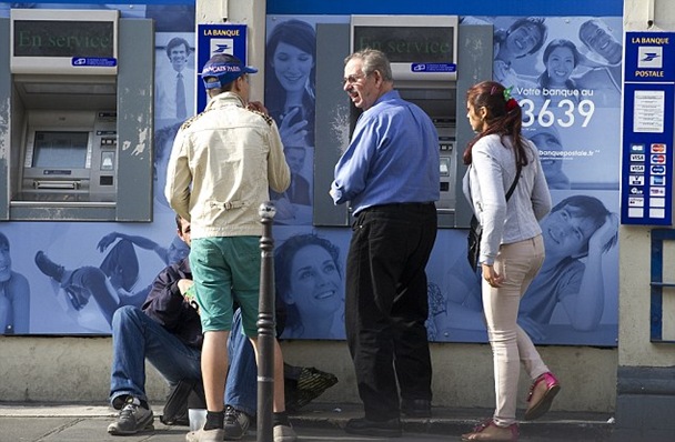 As the boy distracts the man the girl tries to swipe his cash As the boy distracts the man the girl tries to swipe his cash