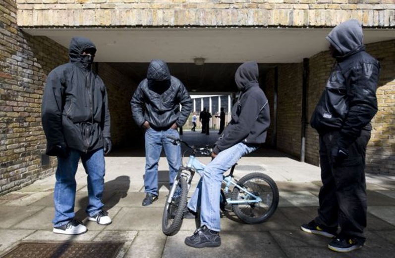 Gang members posing in Brixton, a majority Black area in London Gang members posing in Brixton, a majority Black area in London