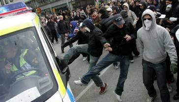 Masked AFA gang members attack police officers.