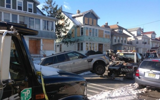 The rangerover that was carjacked being towed from a Newark garage where it was found. The rangerover that was carjacked being towed from a Newark garage where it was found.