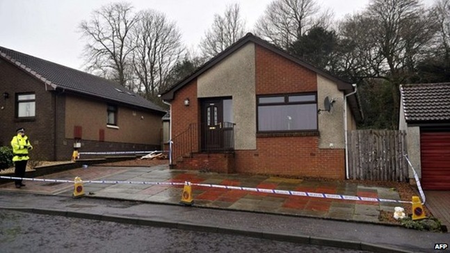 A house in Kirkcaldy was searched by police officers after Mikaeel's body was found in a wooded area behind it A house in Kirkcaldy was searched by police officers after Mikaeel's body was found in a wooded area behind it
