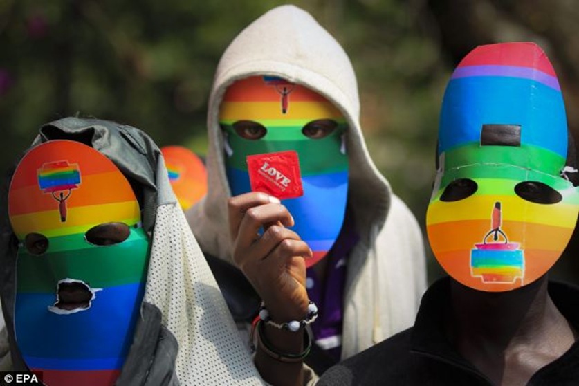 The new legislation, passed this week, have criminalised the 'promotion of homosexuality'. Activists have blasted the laws but, facing life-imprisonment, cannot show their faces The new legislation, passed this week, have criminalised the 'promotion of homosexuality'. Activists have blasted the laws but, facing life-imprisonment, cannot show their faces