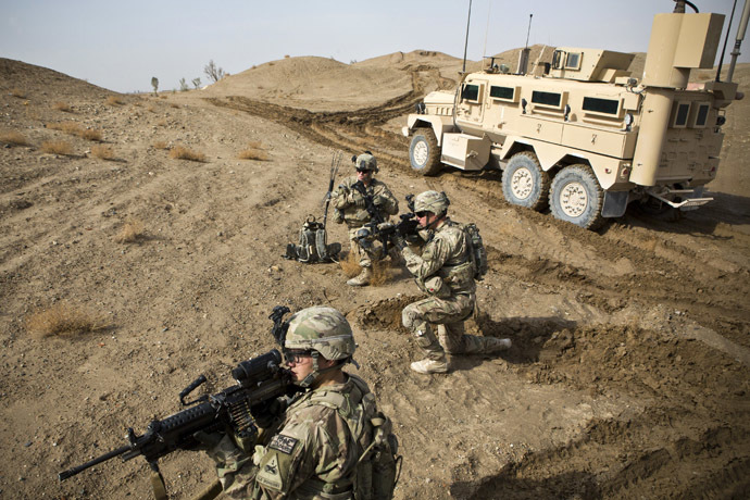 U.S. Army soldiers with Charlie Company, 36th Infantry Regiment, 1st Armored Division set up a supportive position during a mission near Command Outpost Pa'in Kalay in Maiwand District, Kandahar Province February 3, 2013.