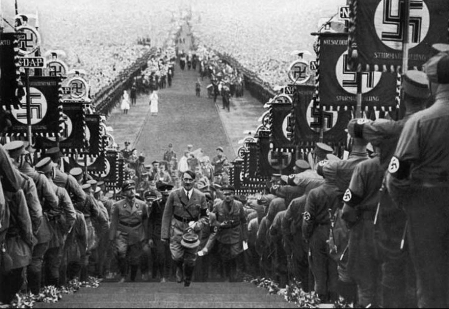 hitler-walking-up-steps-at-nazi-rally