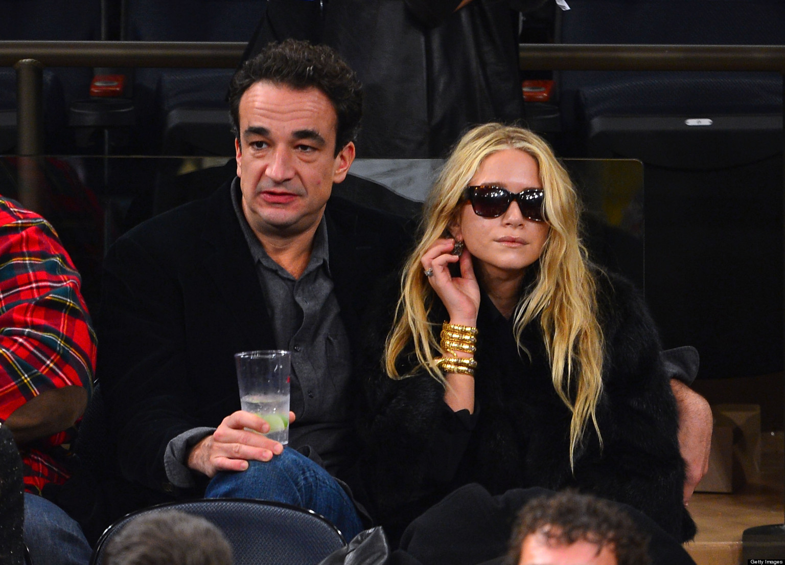 The horrible slut Mary-Kate Olsen models for the young girls by dating a gross old Jew banker.