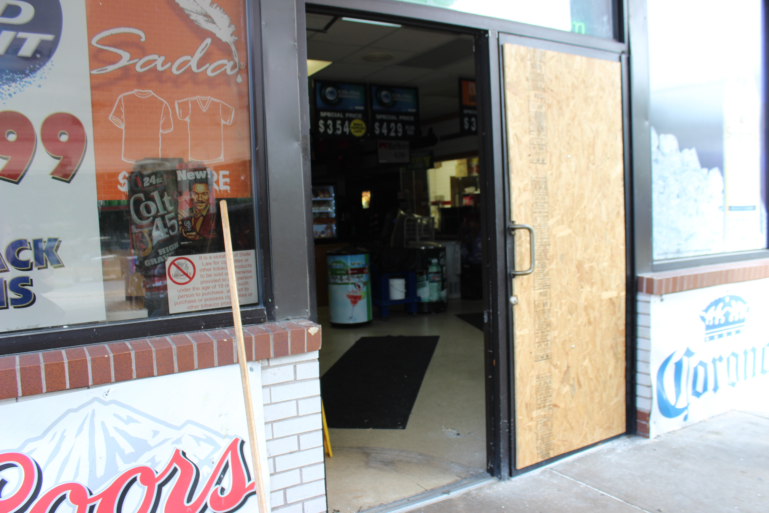 This gas station had both doors busted out.