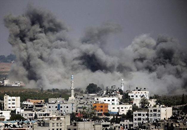 1406870416517_wps_1_Smoke_rises_after_an_Isra 1406870416517_wps_1_Smoke_rises_after_an_Isra