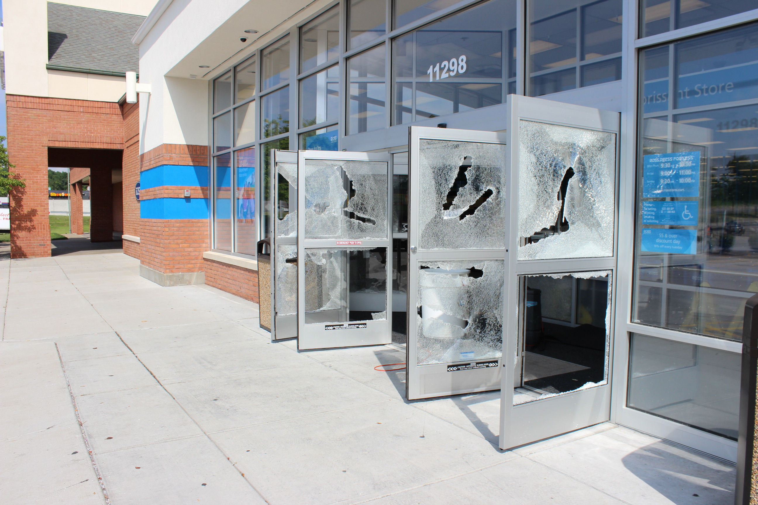 Even once people had access to the stores, it didn't stop them from breaking out the windows.