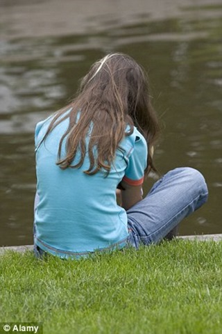 1409481463716_wps_3_Teenage_girl_sad_at_water 1409481463716_wps_3_Teenage_girl_sad_at_water