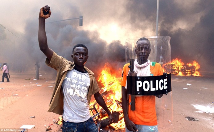 1414671499753_wps_55_Protesters_pose_with_a_po 1414671499753_wps_55_Protesters_pose_with_a_po