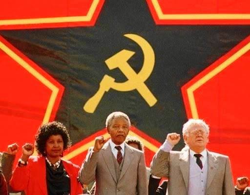 Jews were the key force behind the Blacks overthrowing the government of SA. Here you have Jew Joe Slovo guiding the retard Blacks Winny and Nelson Mandela.