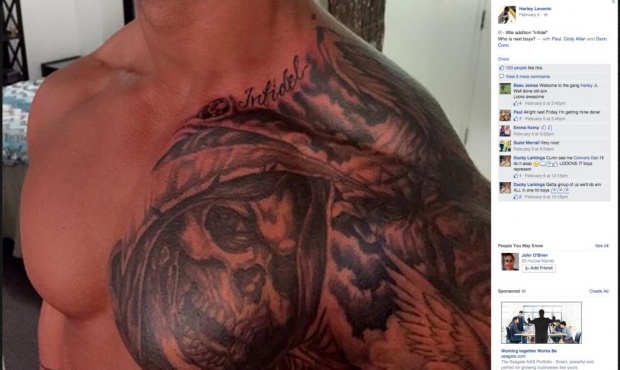 One of the guards' ‘Infidel’ tattoo (plus a demonstration of the magic of anabolic steroids)
