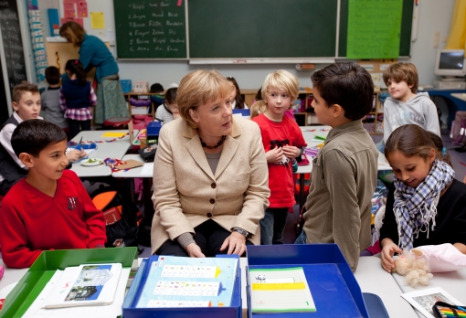 "Angela Merkel spends a day in kindergarten, exploiting children."