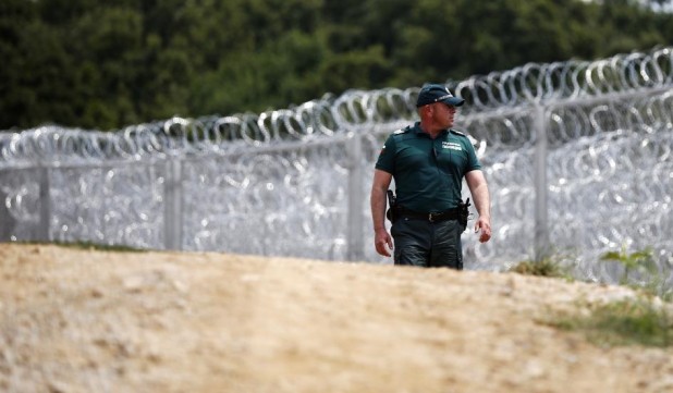 It is basic common sense when you see a fence like this to assume that if you cut through it you're going to get shot.