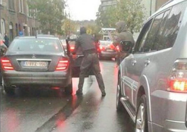 Police swoop in Molenbeek, Brussels, Saturday afternoon, November 14. From Twitter.