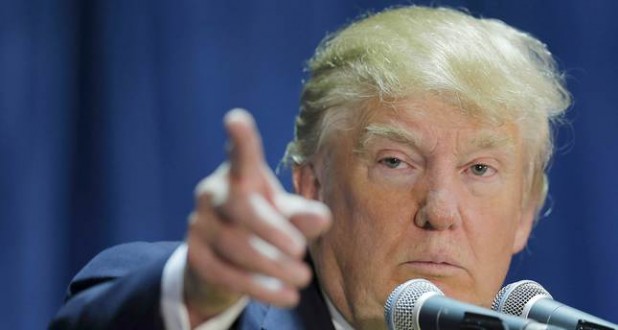 U.S. Republican presidential candidate Donald Trump takes a question from the audience at one of the New England Council's "Politics and Eggs' breakfasts in Manchester, New Hampshire in this November 11, 2015 file photo. To match Special Report USA-ELECTION/TRUMP-BILLS. REUTERS/Brian Snyder/Files