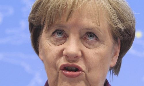 German Chancellor Angela Merkel speaks during a media conference at an EU summit in Brussels on Friday, Dec. 9, 2011. The president of the European Council said Friday that a new intergovernmental treaty meant to save the euro currency will include the 17 eurozone states plus as many as six other European Union countries, but not all 27 EU members. (AP Photo/Yves Logghe)