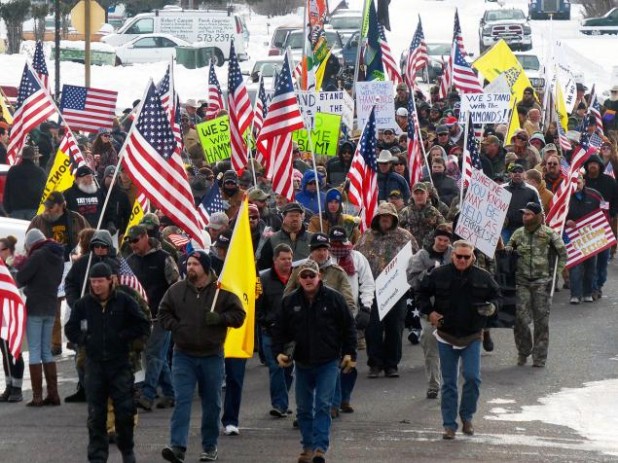 Hundreds of protesters marched in Oregon before occupying the federal preserve.