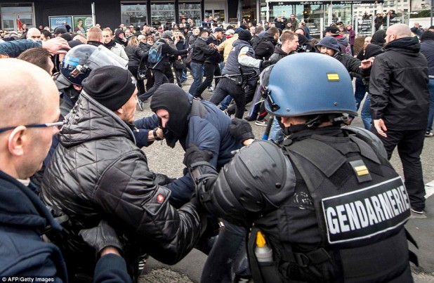 30F1410D00000578-3435093-Policemen_and_gendarmes_arrest_a_man_wearing_a_ski_mask_during_t-a-15_1454797210358