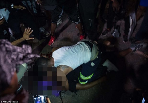 38ab59a300000578-3802230-a_man_is_on_life_support_after_being_shot_as_a_peaceful_protest_-a-56_1474554329640
