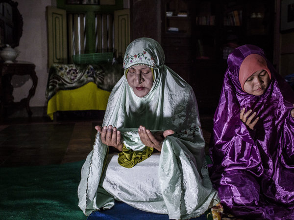 YOGYAKARTA, INDONESIA - JULY 08: Shinta Ratri, a leader of a Pesantren boarding school, Al-Fatah, for transgender people known as 'waria' prays during Ramadan on July 08, 2015 in Yogyakarta, Indonesia. During the holy month of Ramadan the 'waria' community gather to break the fast and pray together. 'Waria' is a term derived from the words 'wanita' (woman) and 'pria' (man). The Koran school Al-Fatah was set back last year's by Shinta Ratri at her house as a place for waria to pray, after their first founder Maryani died. The school operates every Sunday. Islam strictly segregates men from women when praying, leaving no-where for 'the third sex' waria to pray before now. (Photo by Ulet Ifansasti/Getty Images)