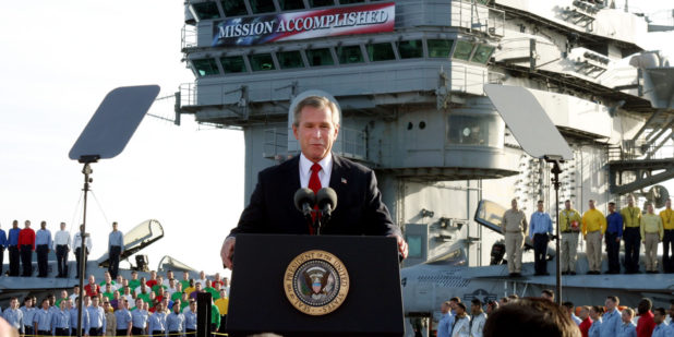 ** FILE ** President Bush declares the end of major combat in Iraq as he speaks aboard the aircraft carrier USS Abraham Lincoln off the California coast, in this May 1, 2003 file photo. Democratic congressional leaders on Tuesday, May 1, 2007 sent Iraq legislation setting timetables for U.S. troop withdrawals to President George W. Bush and a certain veto.  On the fourth anniversary of the president's "Mission Accomplished" speech, Senate Majority Democratic Leader Harry Reid said that Bush "has put our troops in the middle of a civil war. A change of course is needed."  (AP Photo/J. Scott Applewhite)