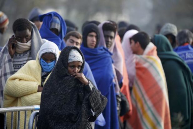 Migrants who claim to be minors wait for their registration and their evacuation on the third day of the dismantlement of the camp called the "Jungle" in Calais